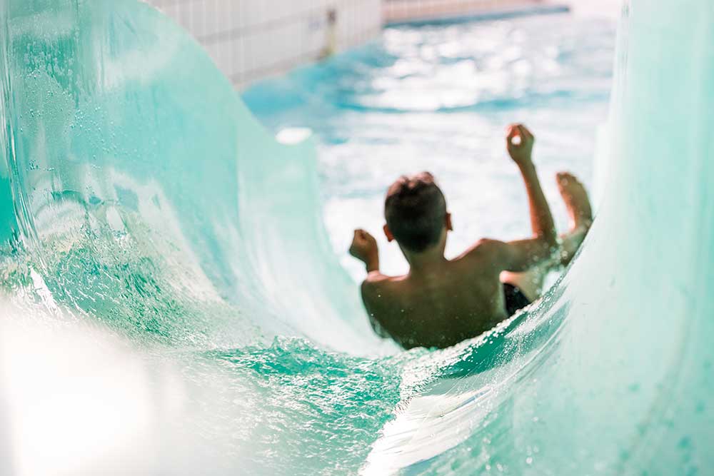 Water slide at a campground in Brittany with a swimming pool